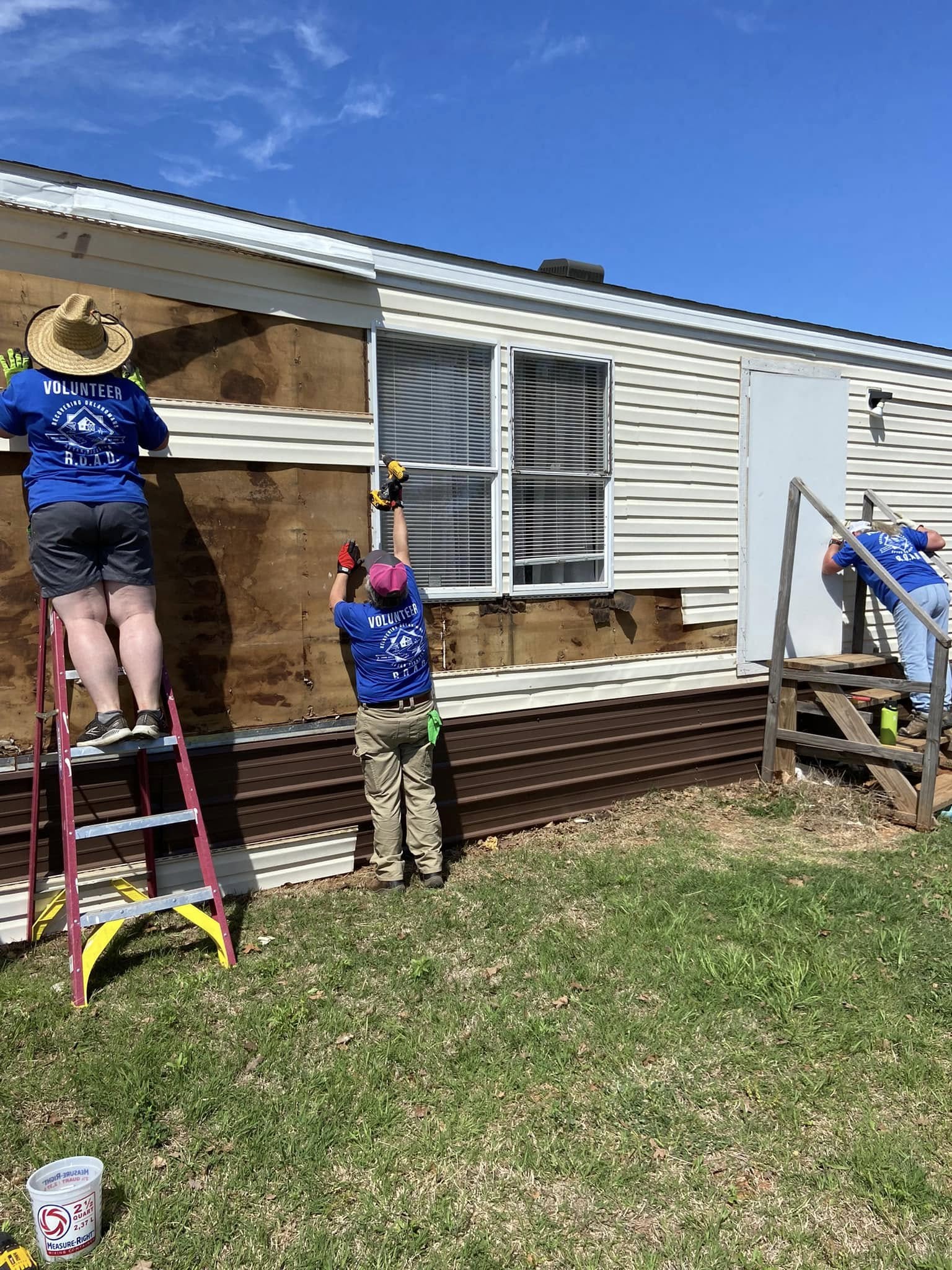 installing siding - Sister Corps